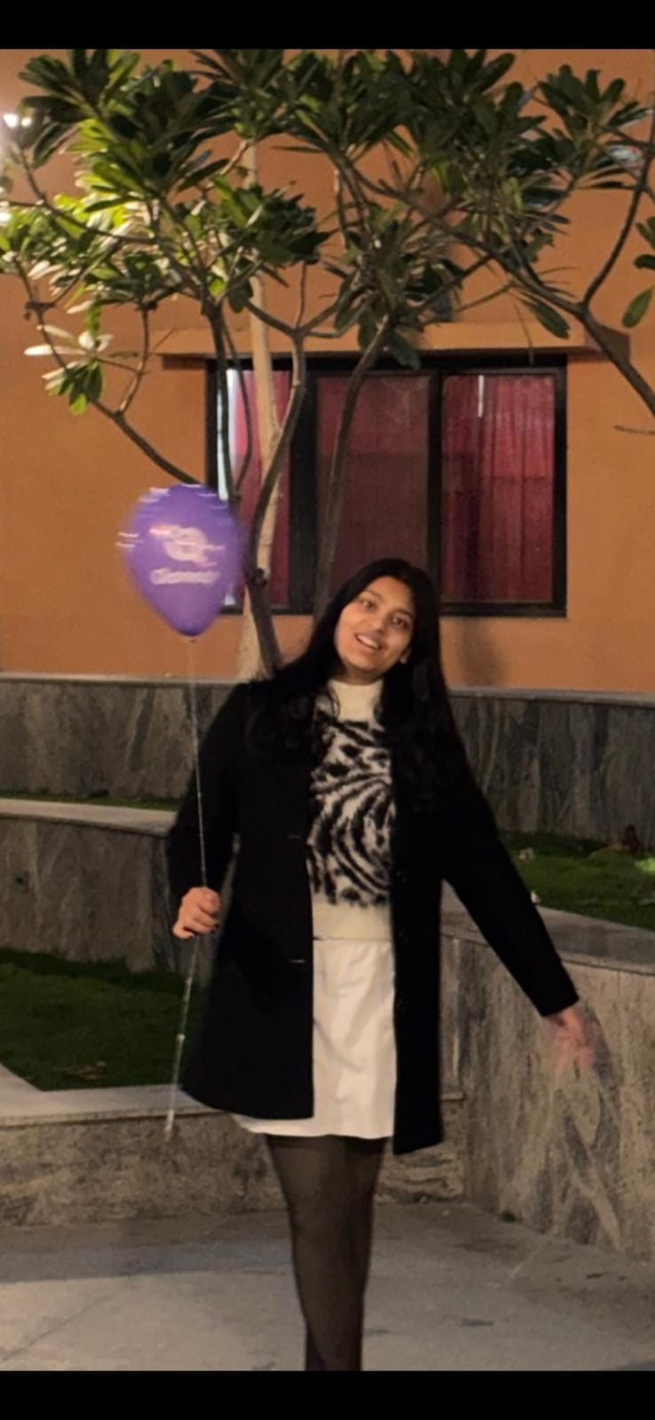 Princess energy with a balloon in hand.